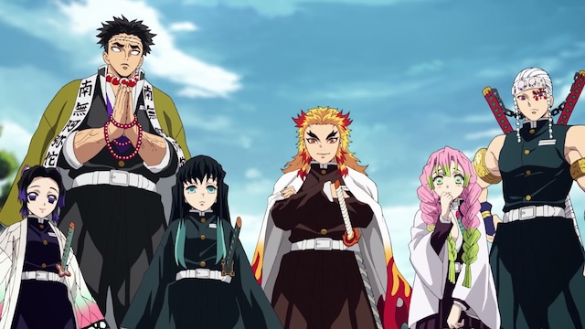 kimetsu no yaiba review, the hashira stand together outdoors in their demon slayer uniforms under a cloudy sky